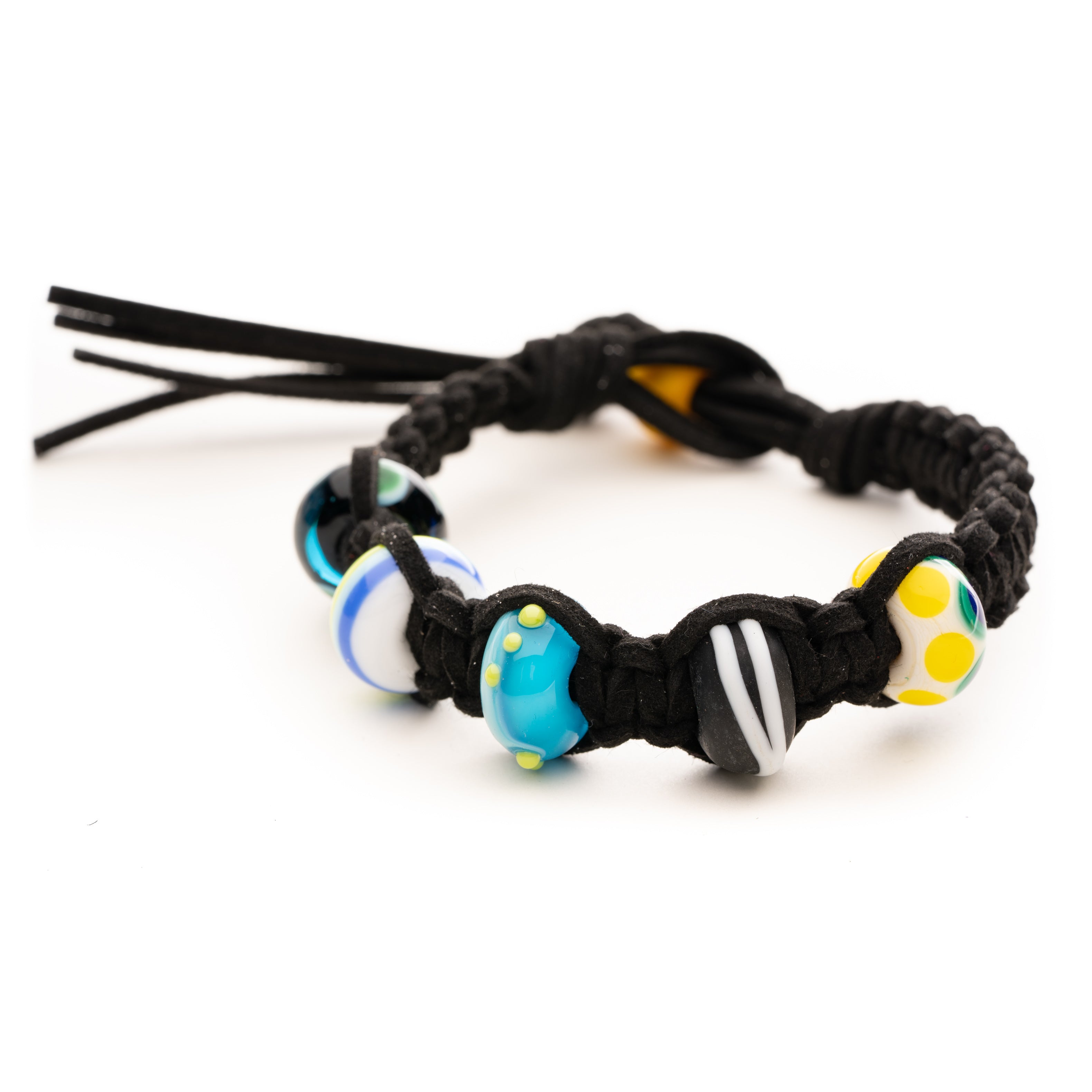 Black cord bracelet with travel inspired surf beads.