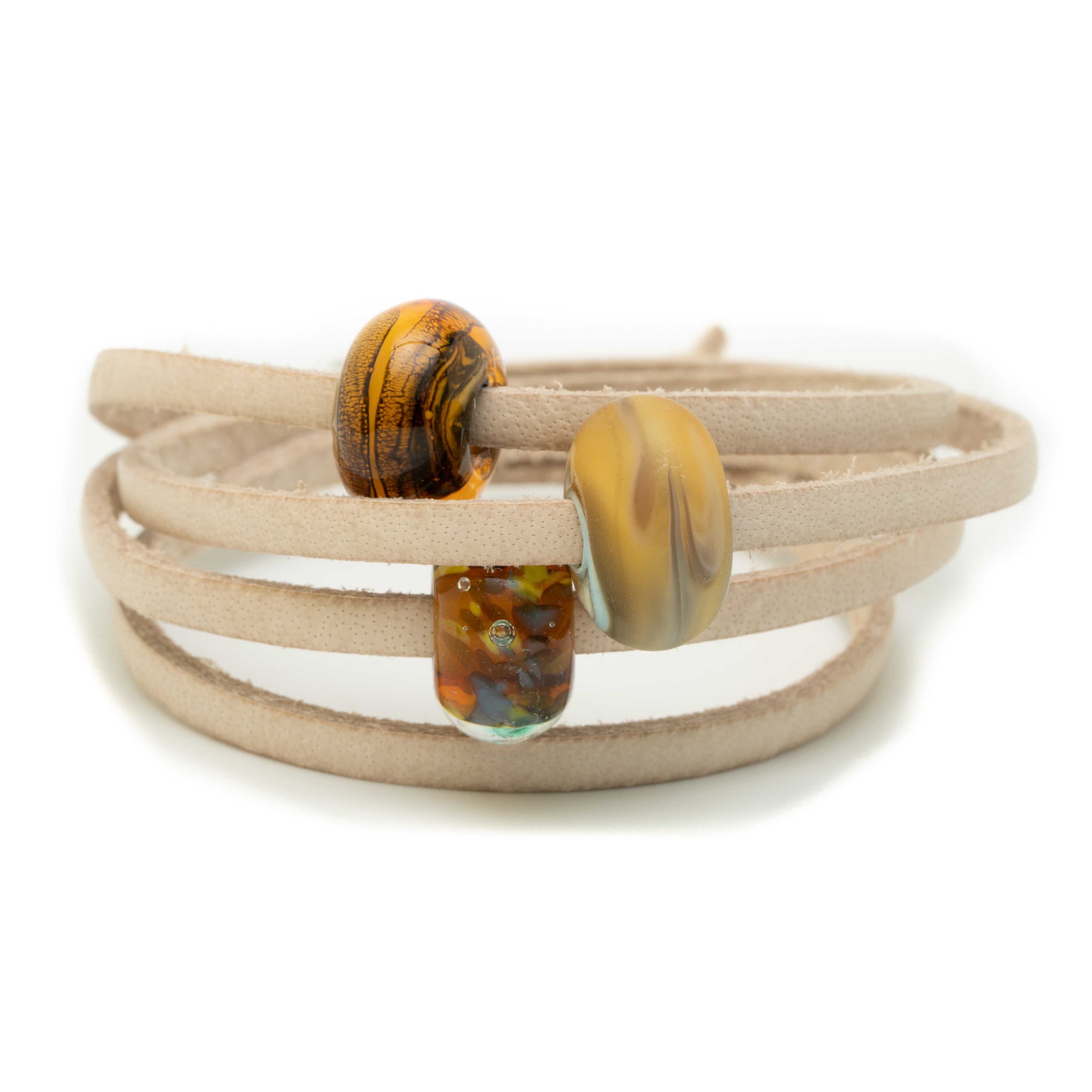 Sand leather bracelet with neutral colored glass beads representing the jurassic coast.