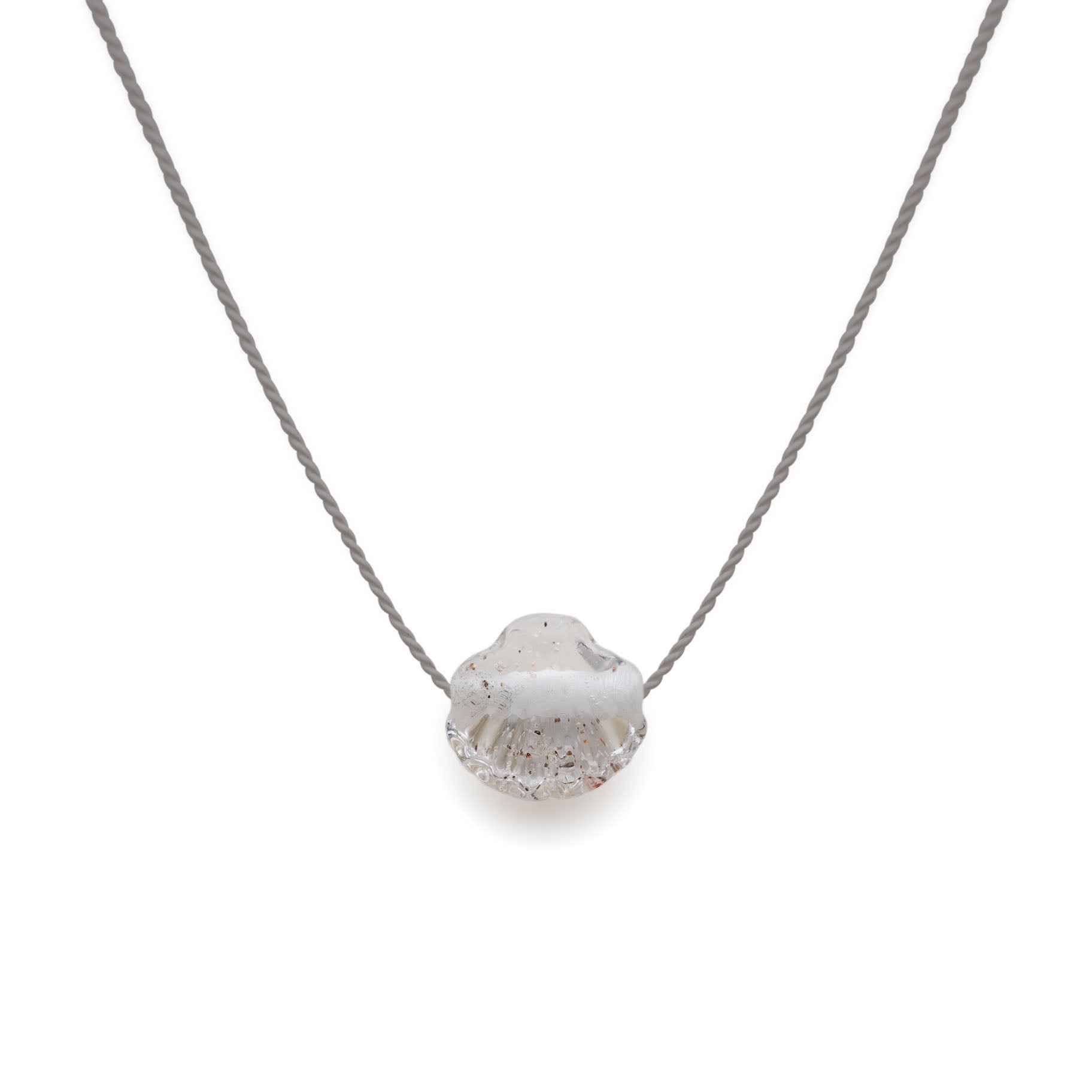 Necklace with a textured heart-shaped pendant on a white background