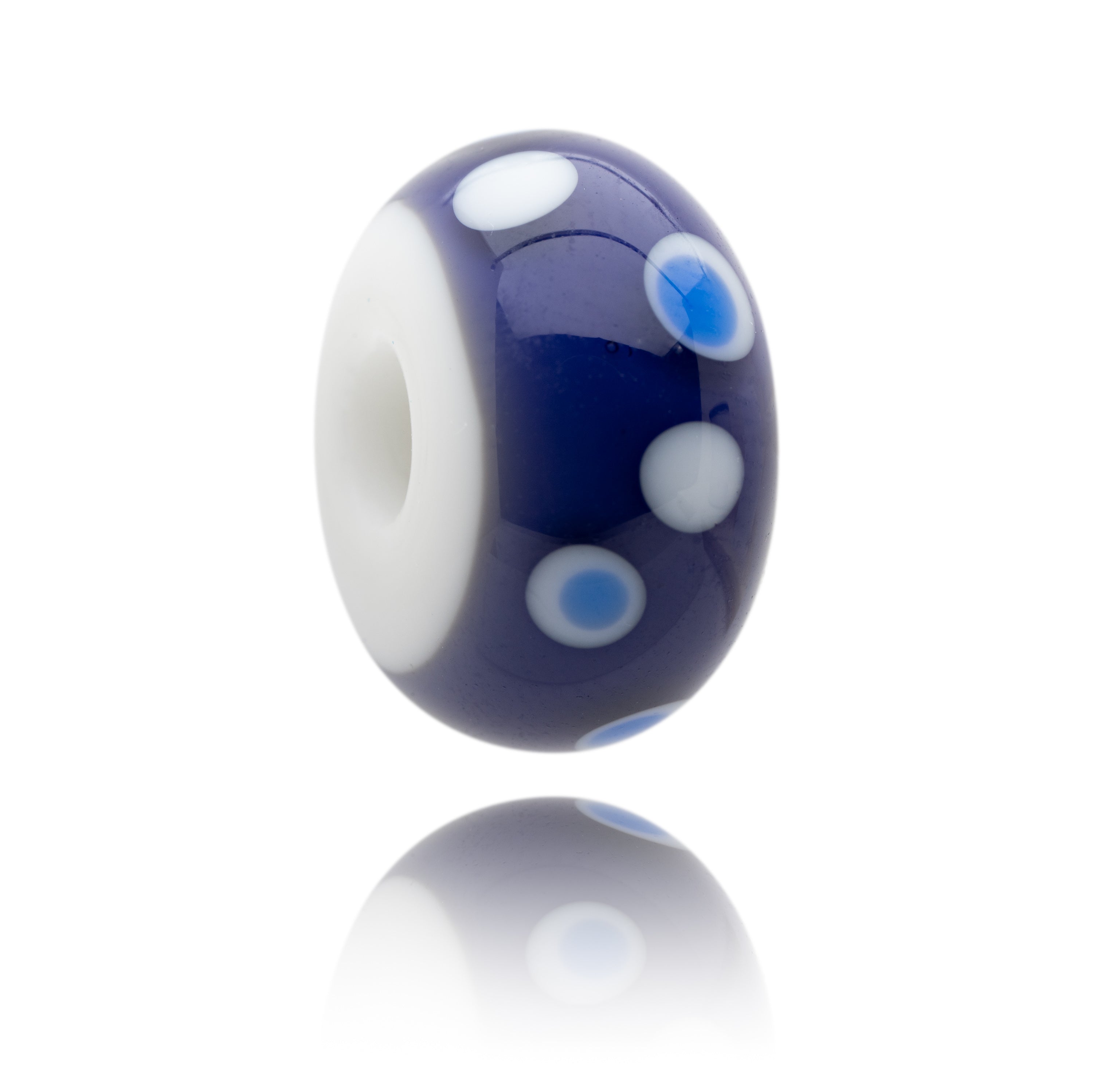 Purple and white glass beads with white and blue dots on surface, representing Calshot Hampshire.