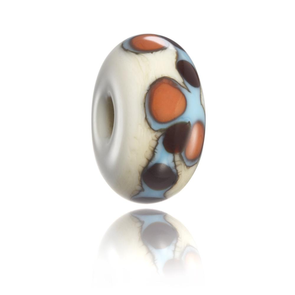 Cream, brown, blue and orange patterned glass bead for Kirra in Australia.