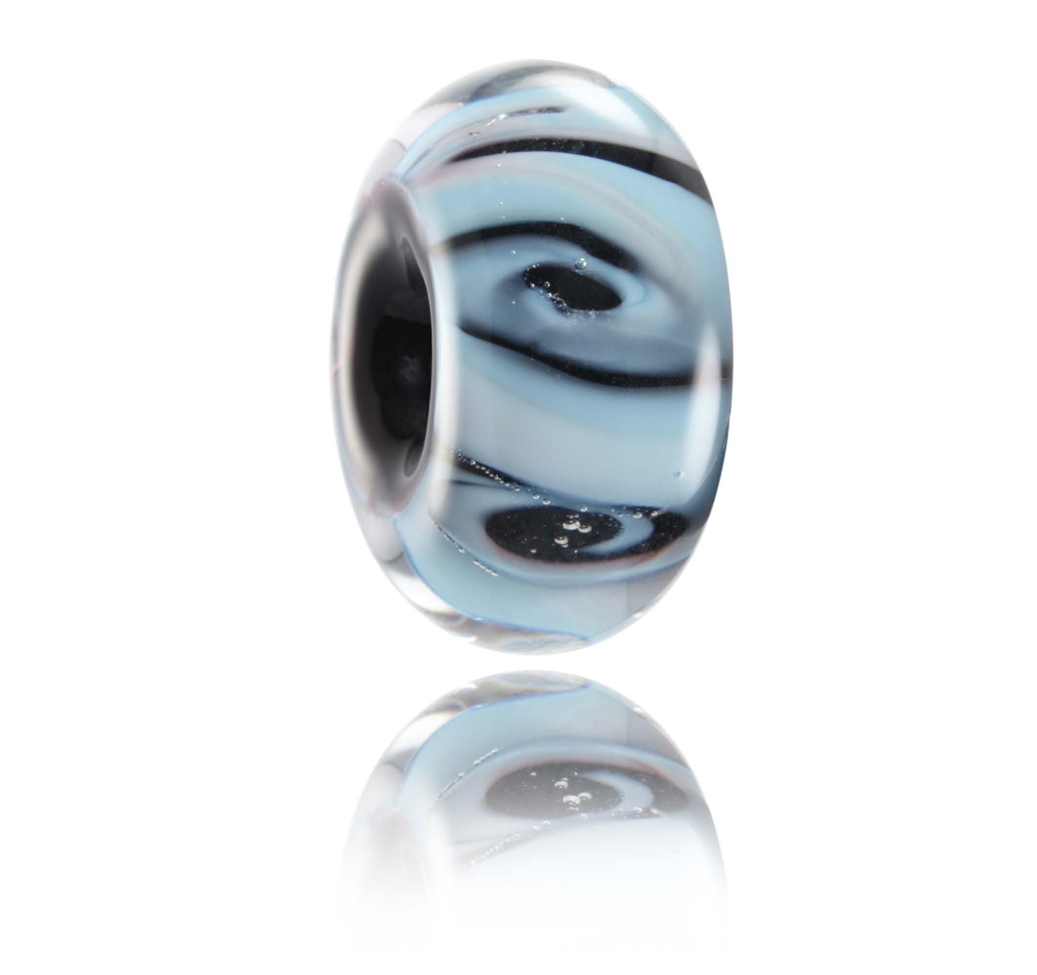 Blue, purple and black glass swirling bead representing Biarritz in France - angle.