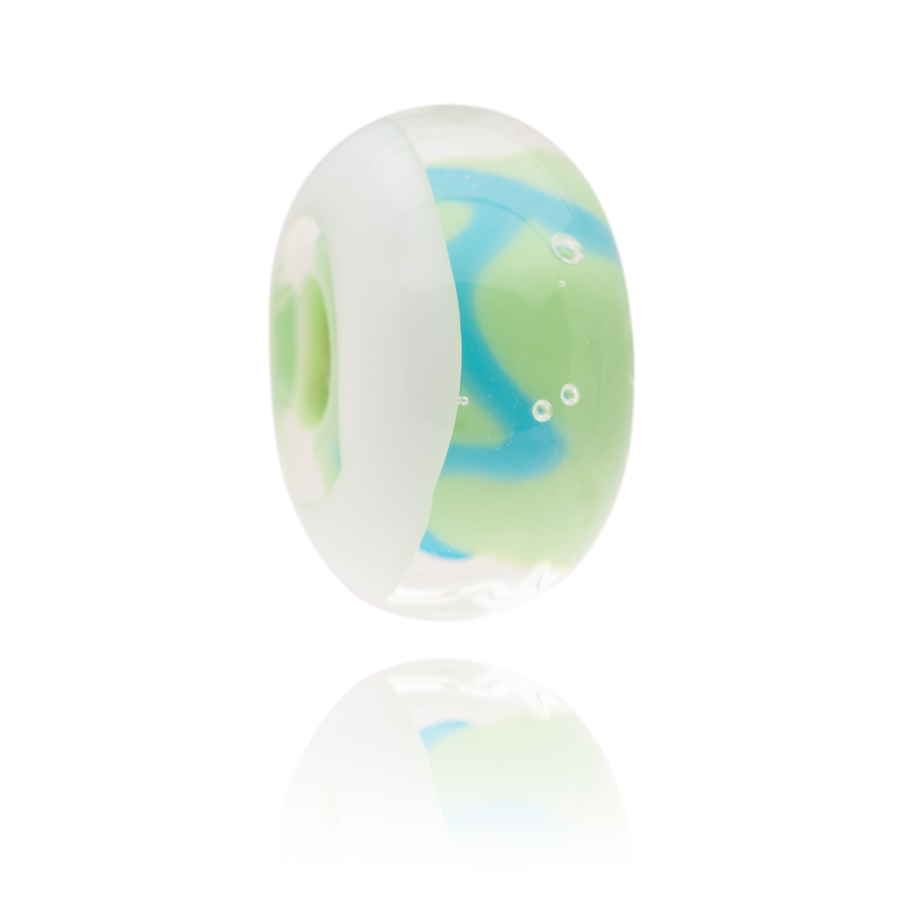 Blue, green and white Murano glass bead representing the beach of Cuckmere Haven in Sussex.