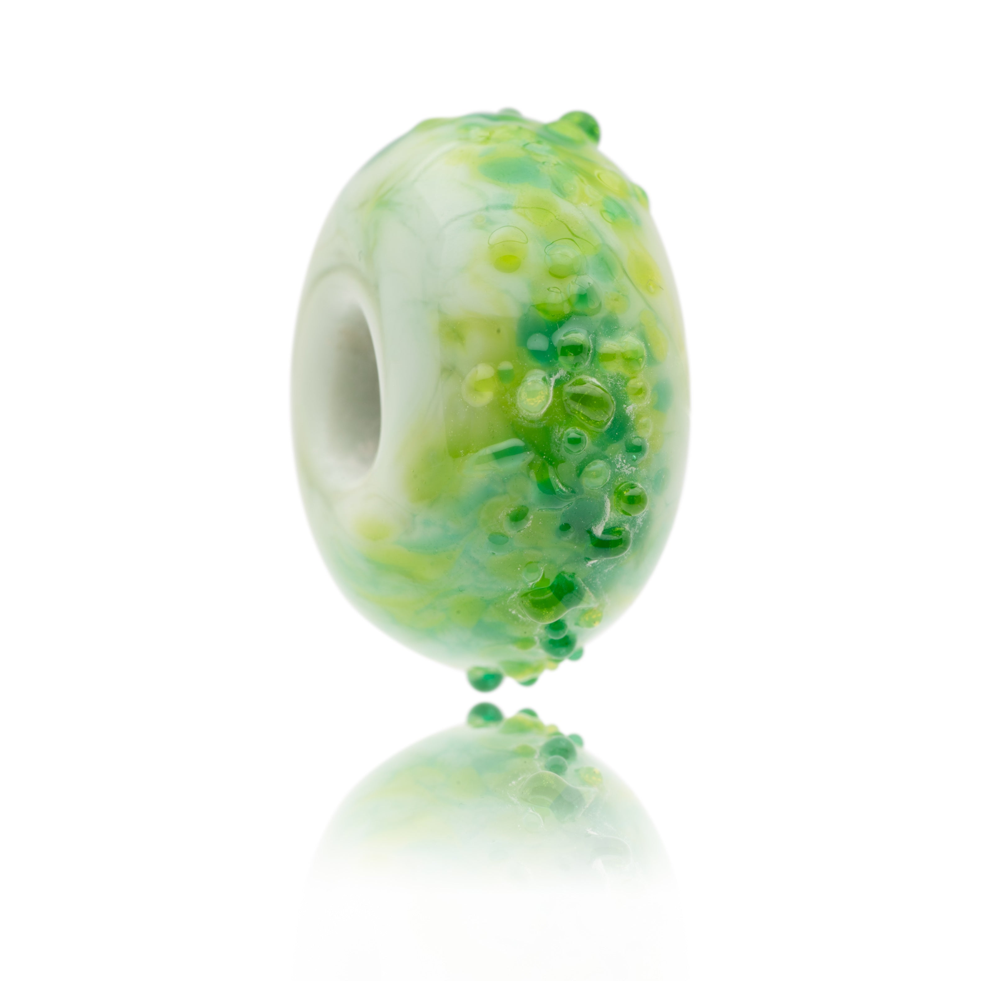 Green glass bead with shards of light and dark green glass on the surface. This bead represents Ballybunion in Ireland.