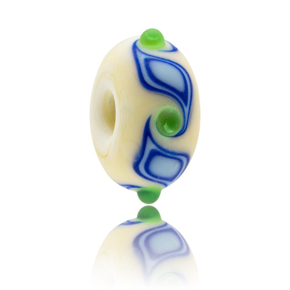 Cream glass bead with blue soil patterns and green dots on surface with a matte sea glass finish. Representing the Isle of Wight in the UK.