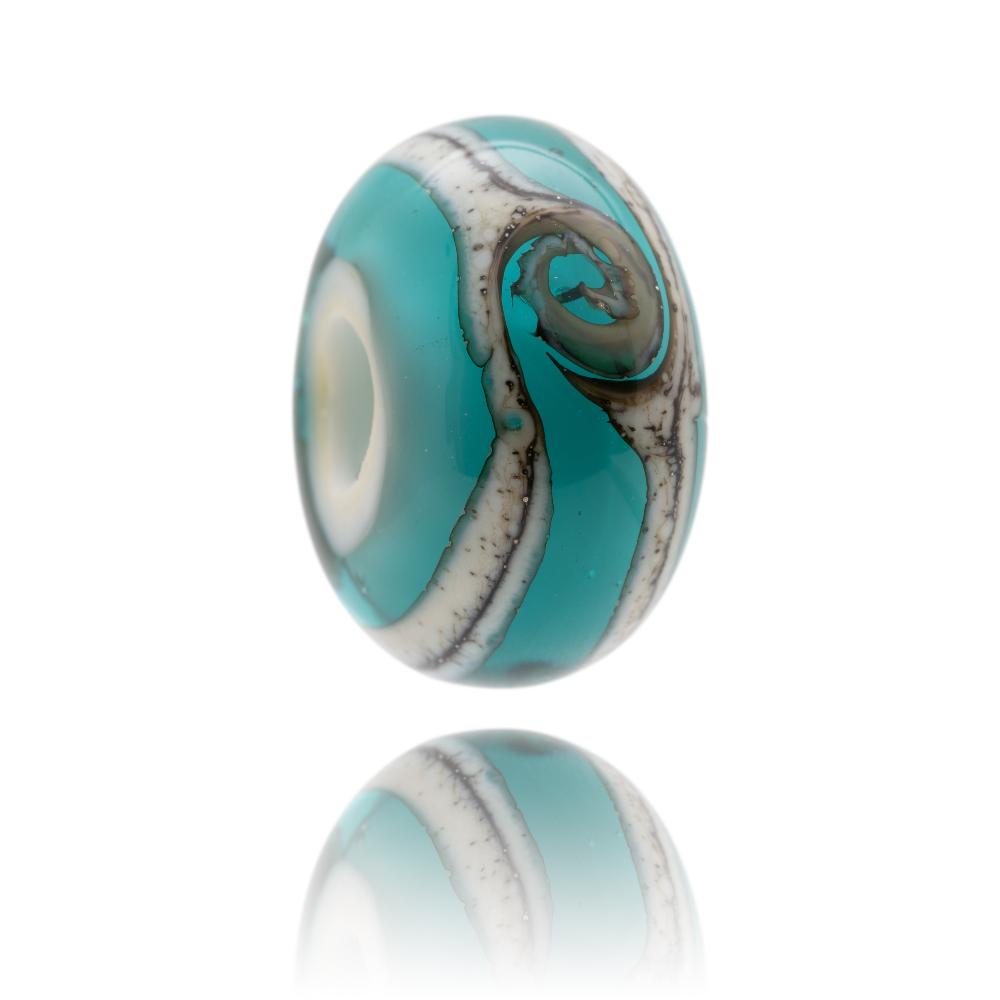 Turquoise glass bead with white core and silver stripes and swirl around the outside. Designed for Durdle Door in Dorset, UK.