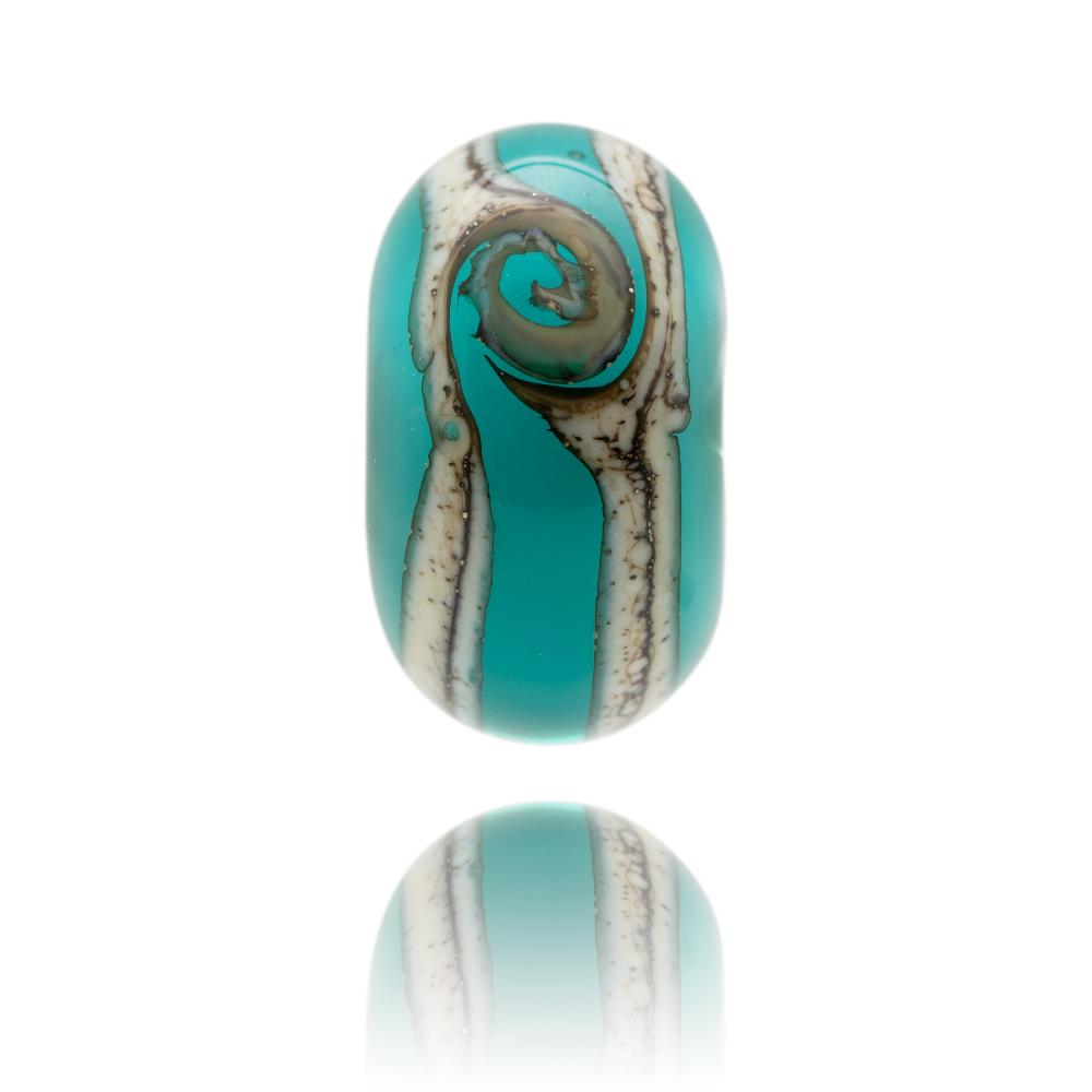 Turquoise glass bead with white core and silver stripes and swirl around the outside. Designed for Durdle Door in Dorset, UK.