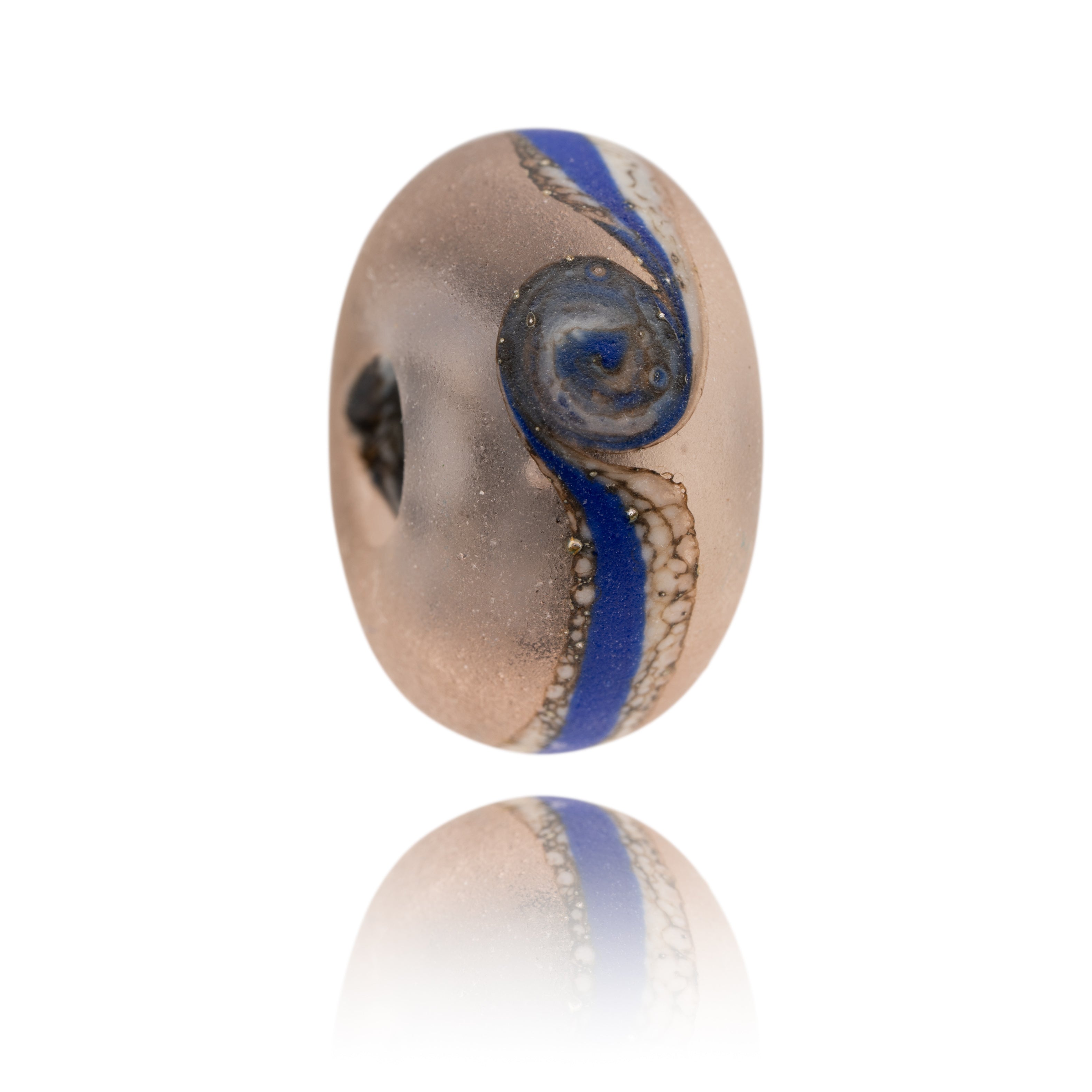 Frosted pink glass bead decorated with blue stripe around middle. Representing Embleton Beach in Northumberland.