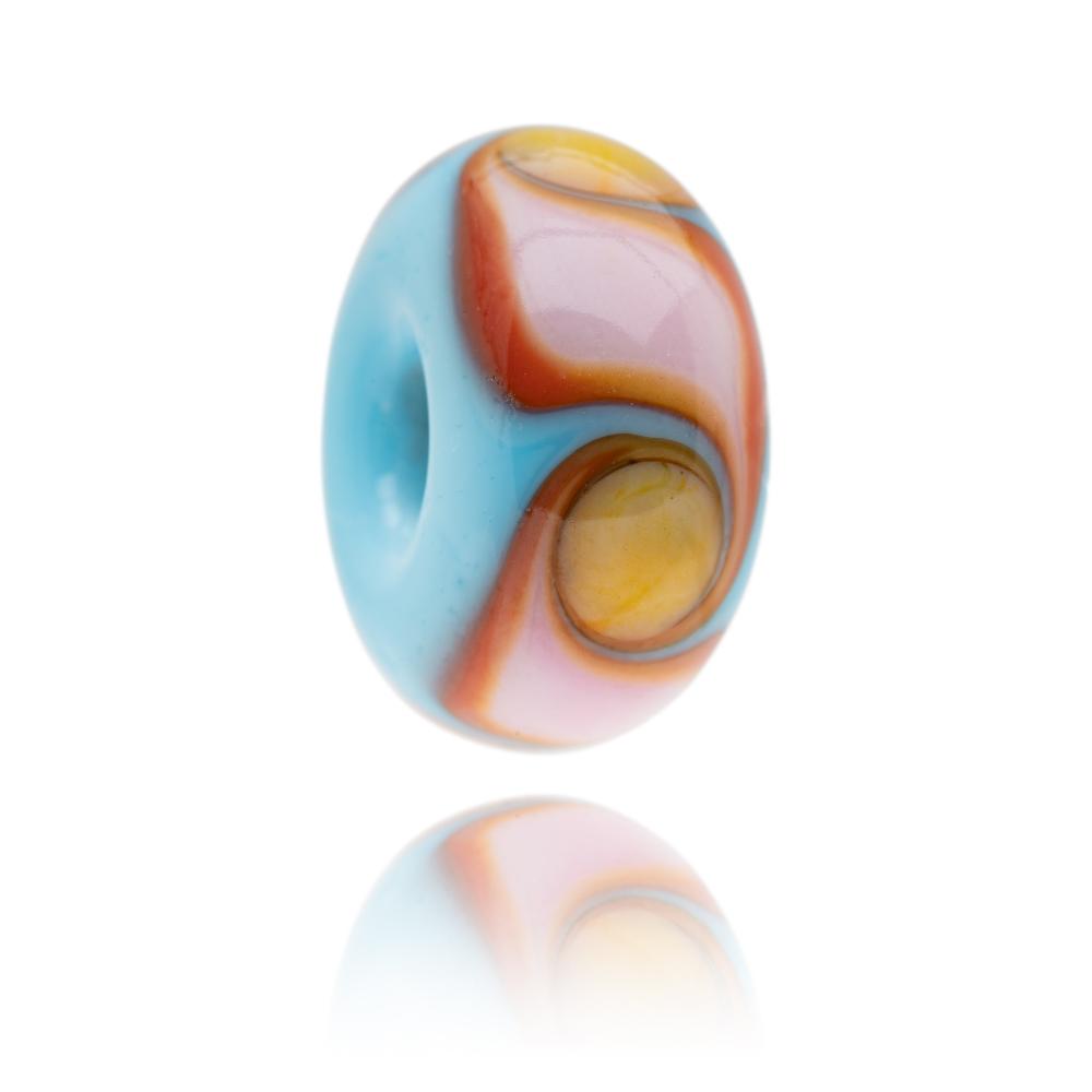 Blue glass bead by Nalu with Red, pink and orange waves with yellow dots around the surface. Designed for Fistral Beach in Newquay, Cornwall, UK.