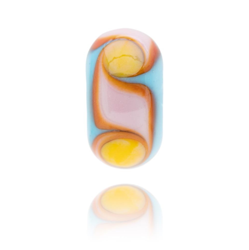 Blue glass bead by Nalu with Red, pink and orange waves with yellow dots around the surface. Designed for Fistral Beach in Newquay, Cornwall, UK.