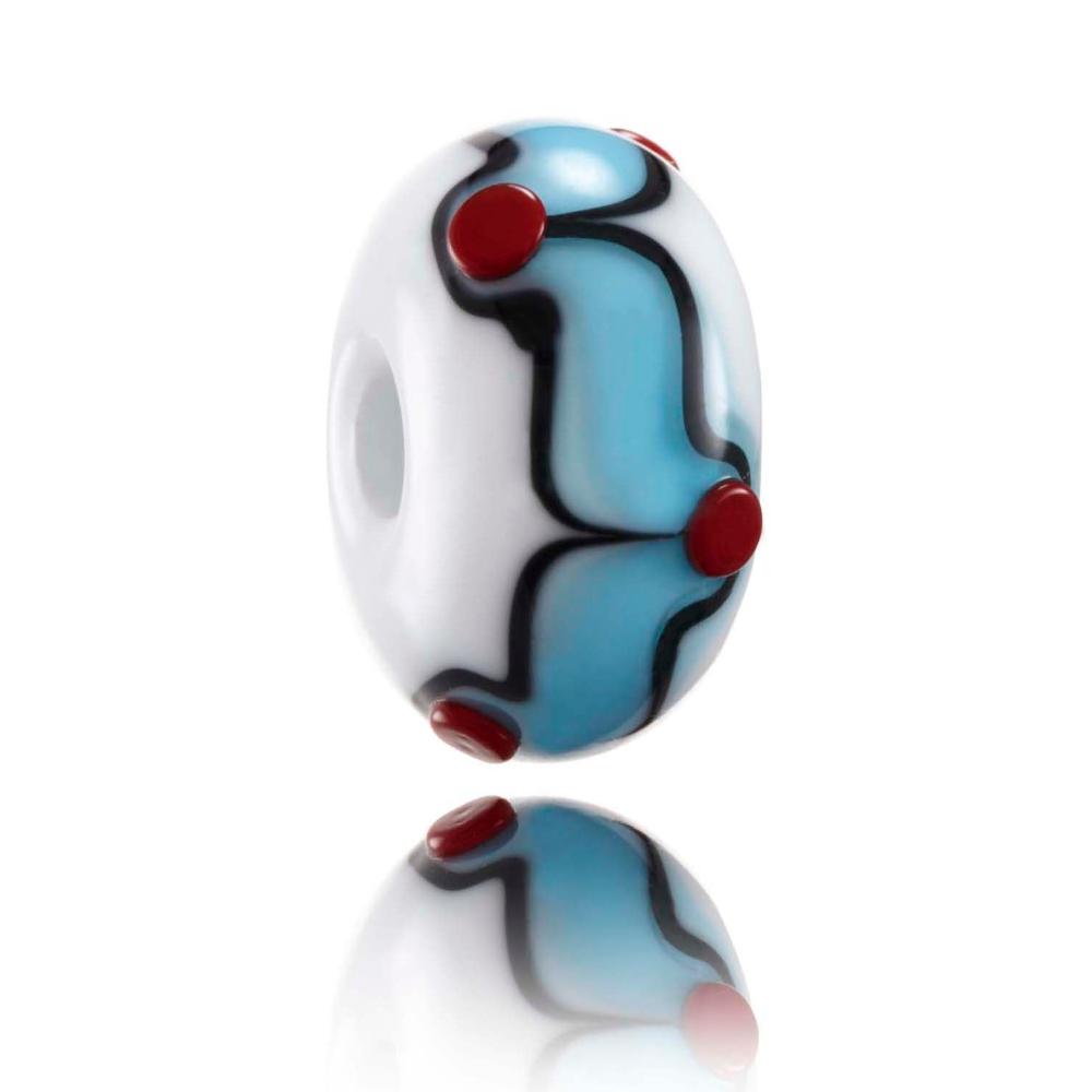 White glass bead with blue, black and red surface patterns representing Freshwater West in Wales.