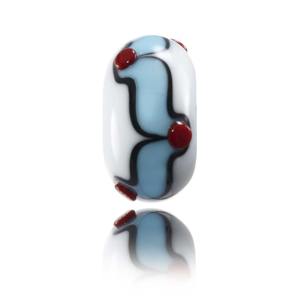 White glass bead with blue, black and red surface patterns representing Freshwater West in Wales.