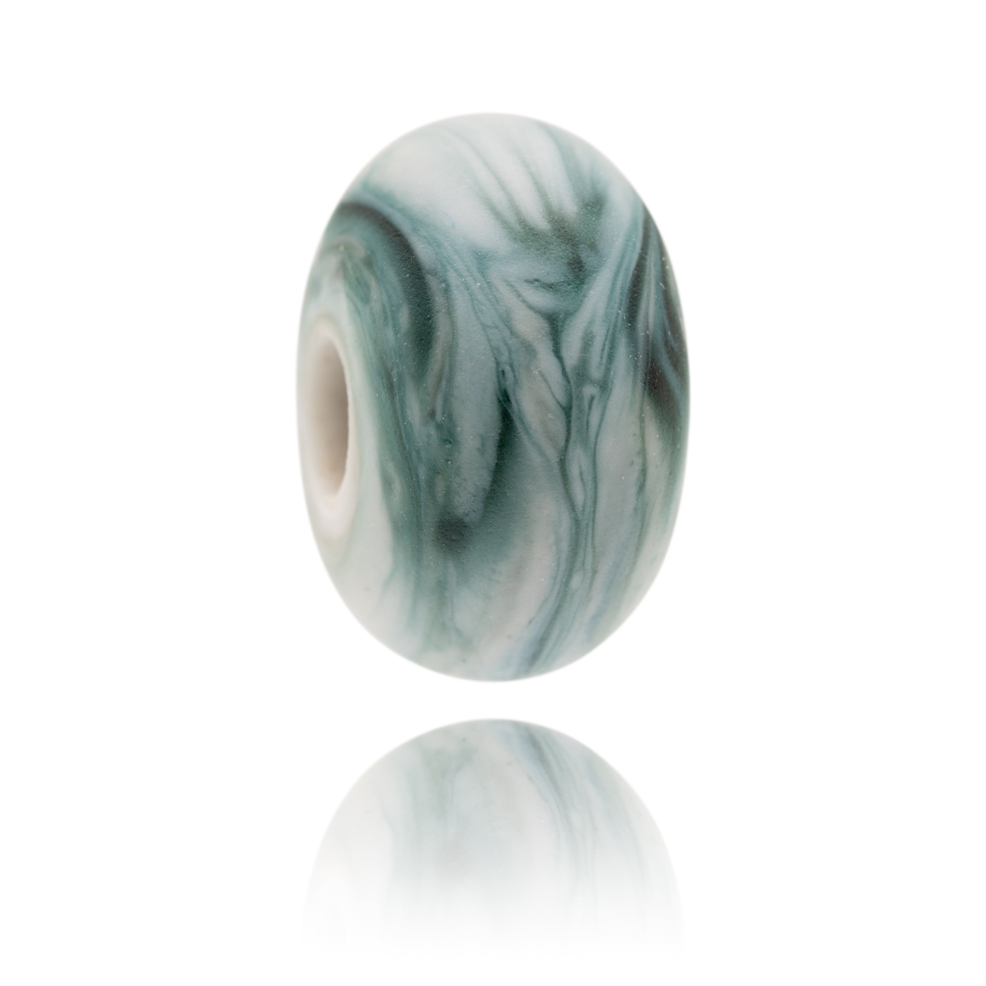 Swirling grey Murano glass bead with frosted surface for Gara Rock in. South Devon.
