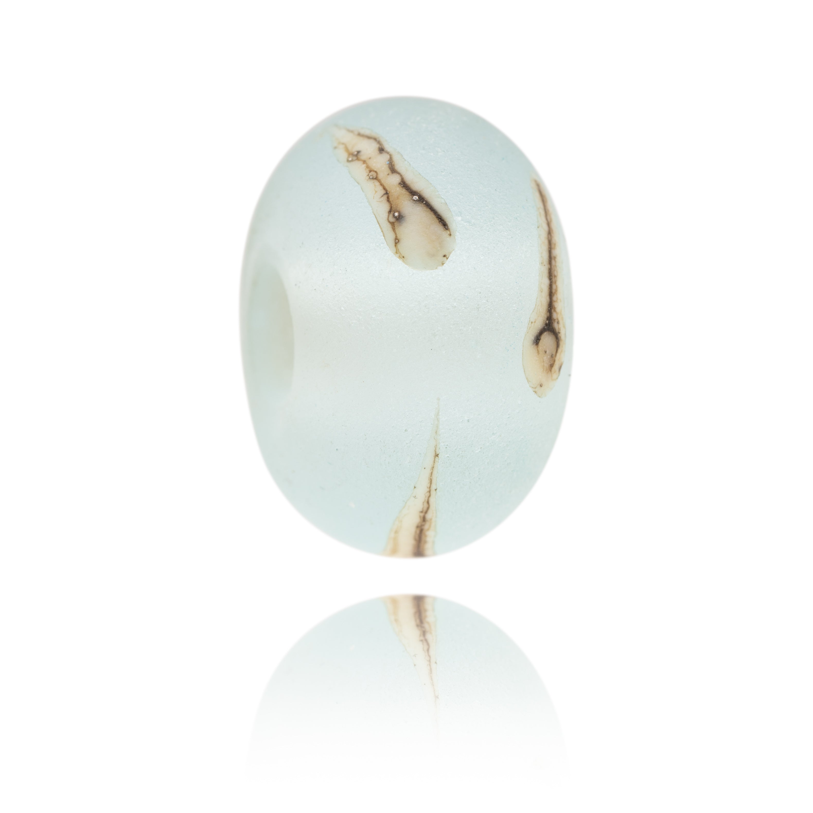 Pale blue Murano glass surf bead with ivory silver splashes, representing Hele Bay, North Devon.
