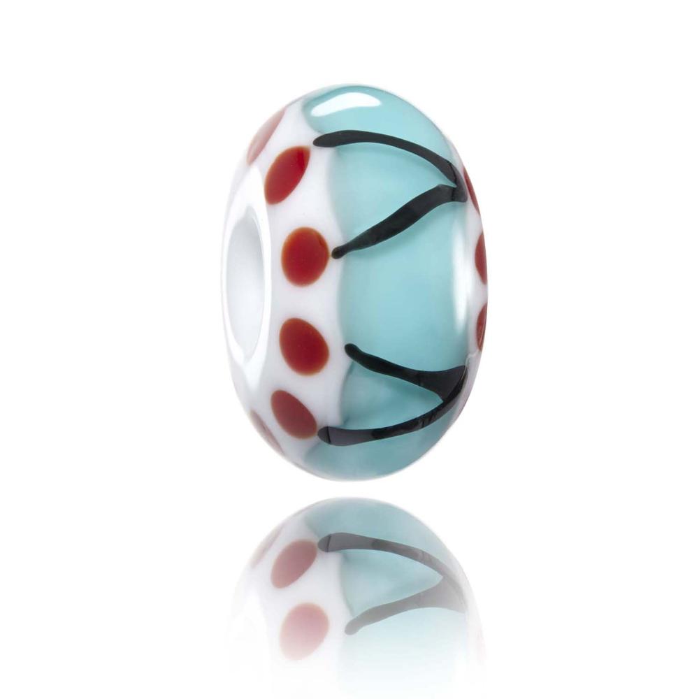 Blue, white glass baed with red dots and black stripes on surface, representing Huntington Beach in California, USA.