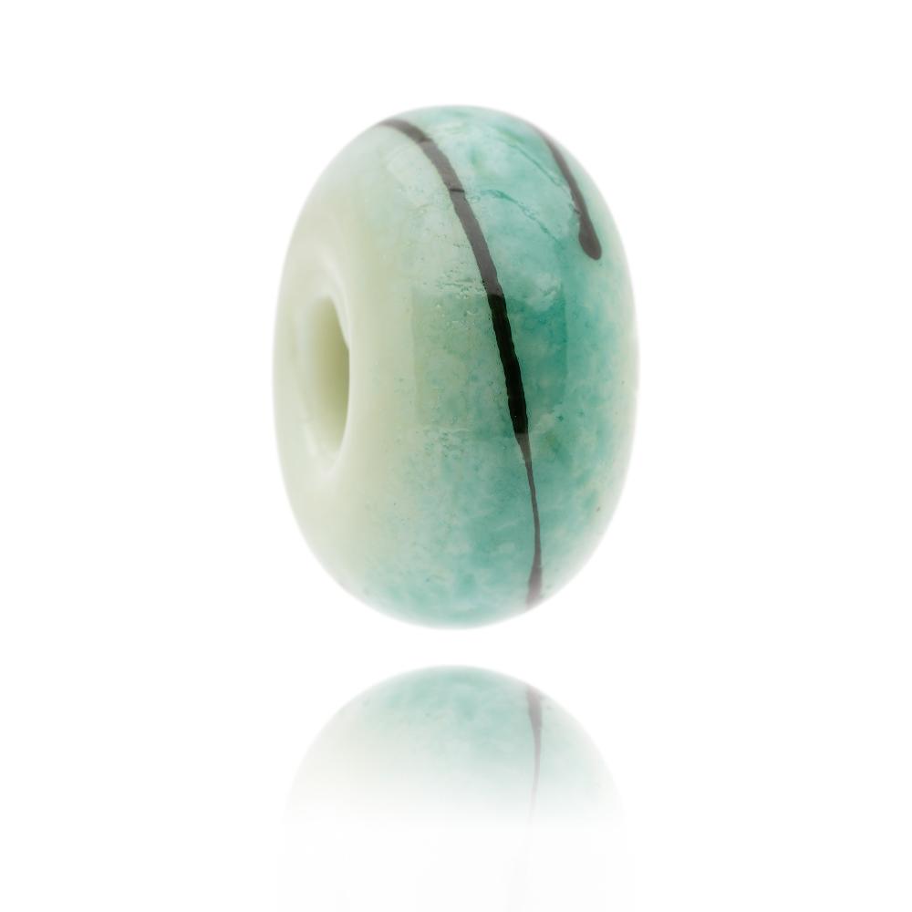 Green glass bead with bluish surface and black stripe around bead. Representing Inchydoney in Ireland.