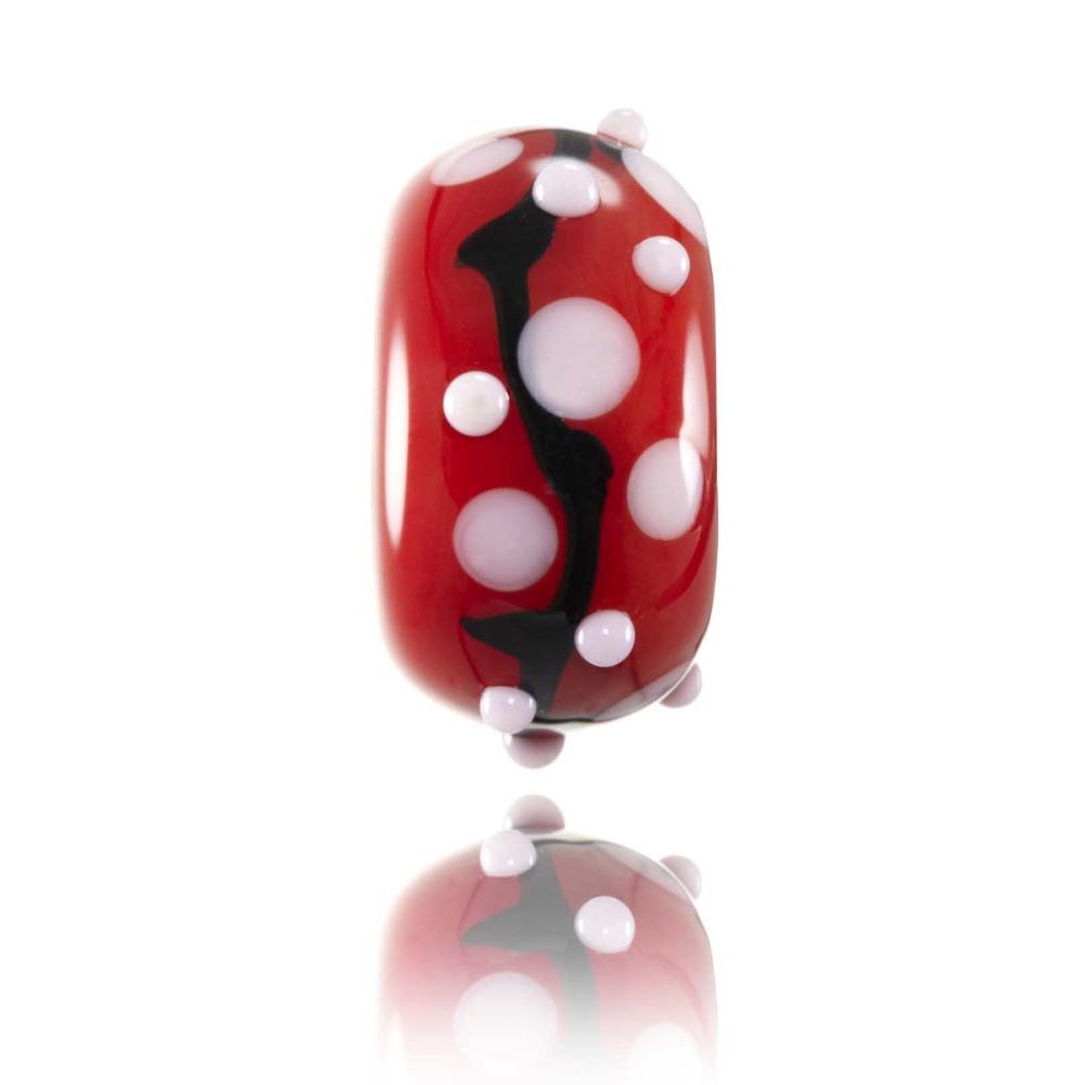 Red glass charm beads with white dots and black stripe patterns representing Japan.