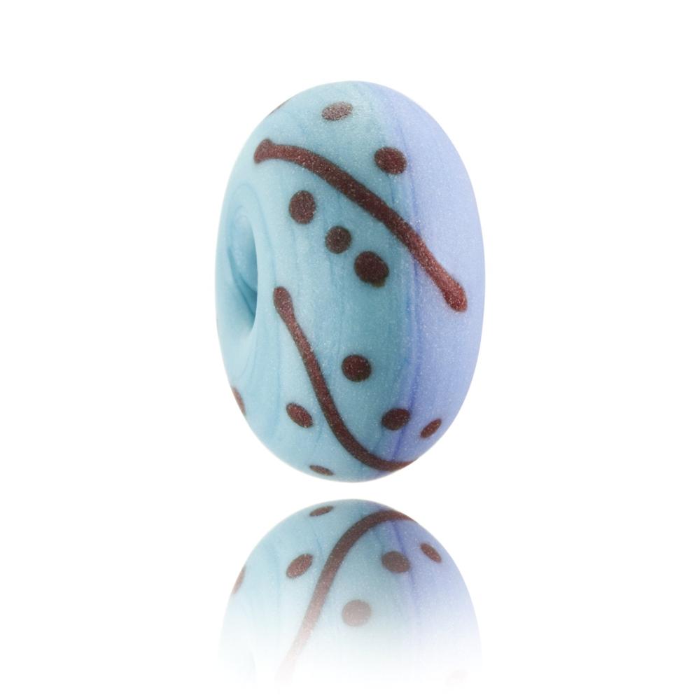 Purple and blue glass bead with red patterned on surface representing Jefferys Bay in South Africa.