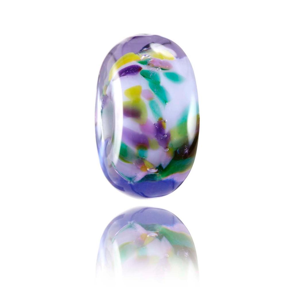 Purple transparent glass bead with a spotty green, purple, pink core and a flower decoration on the surface. Designed for Kauai in Hawaii.