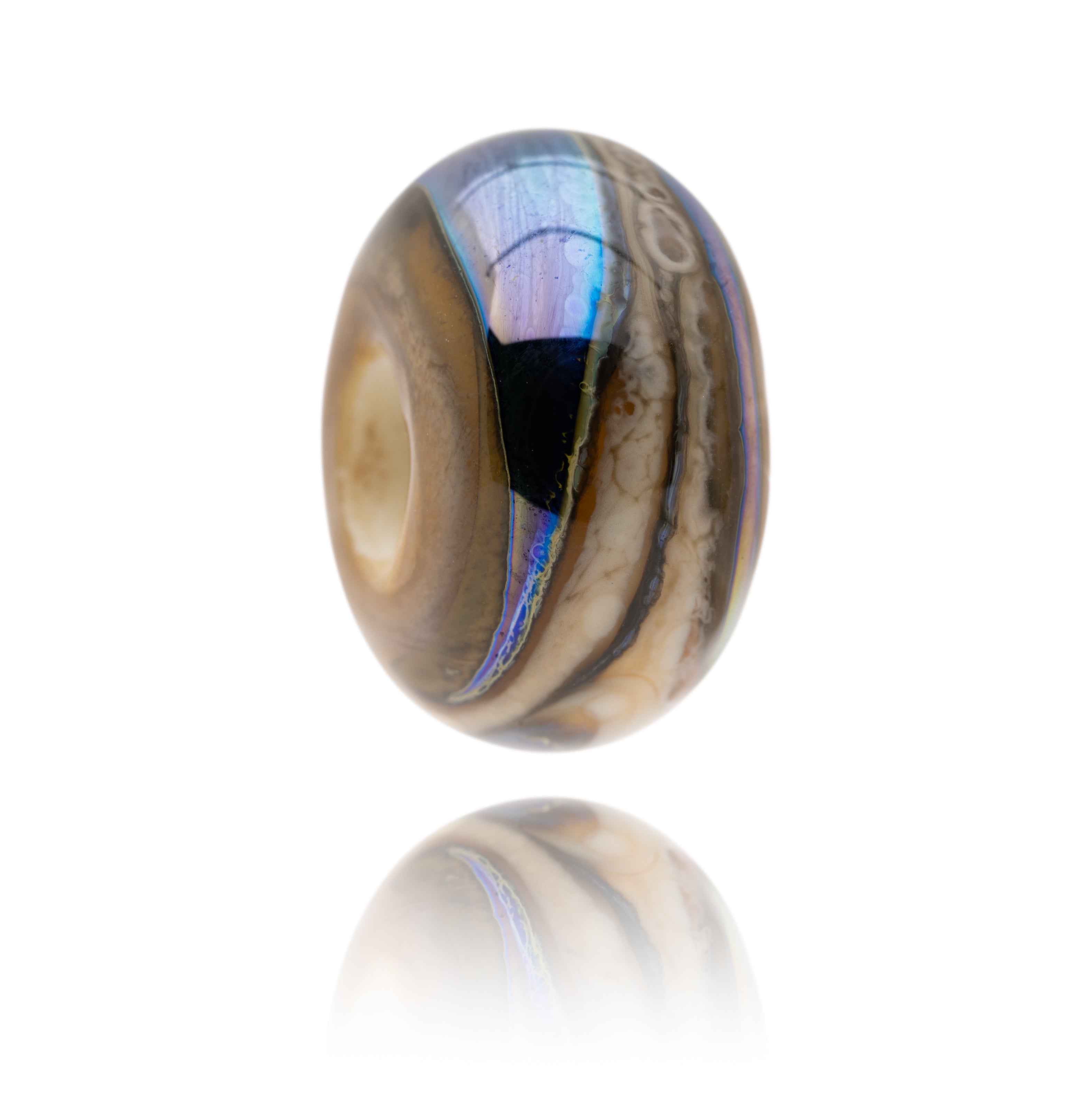 Ivory and blue swirling glass bead representing Longsands Beach in Tynemouth.