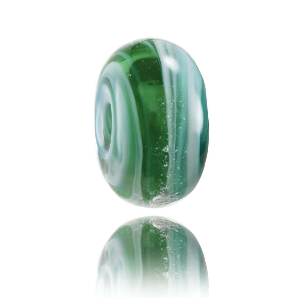 Green, silver and white swirling shimmering glass bead for the Mavericks surf spot in California the USA.