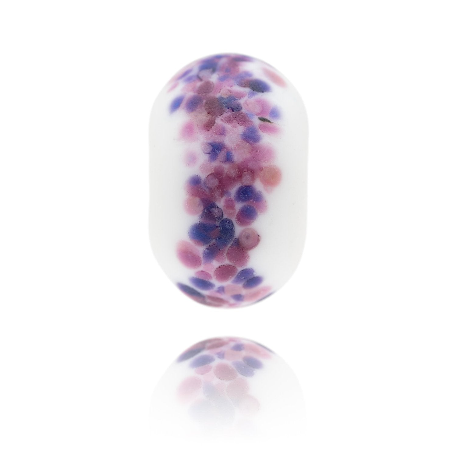 White glass bead with pink and purple spots on the surface representing the Nevis Range in Scotland.