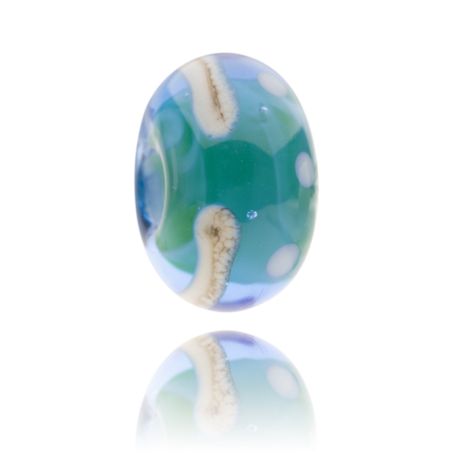 Blue, green swirling glass bead with cream patterns on surface for Newquay Harbour in Cornwall.