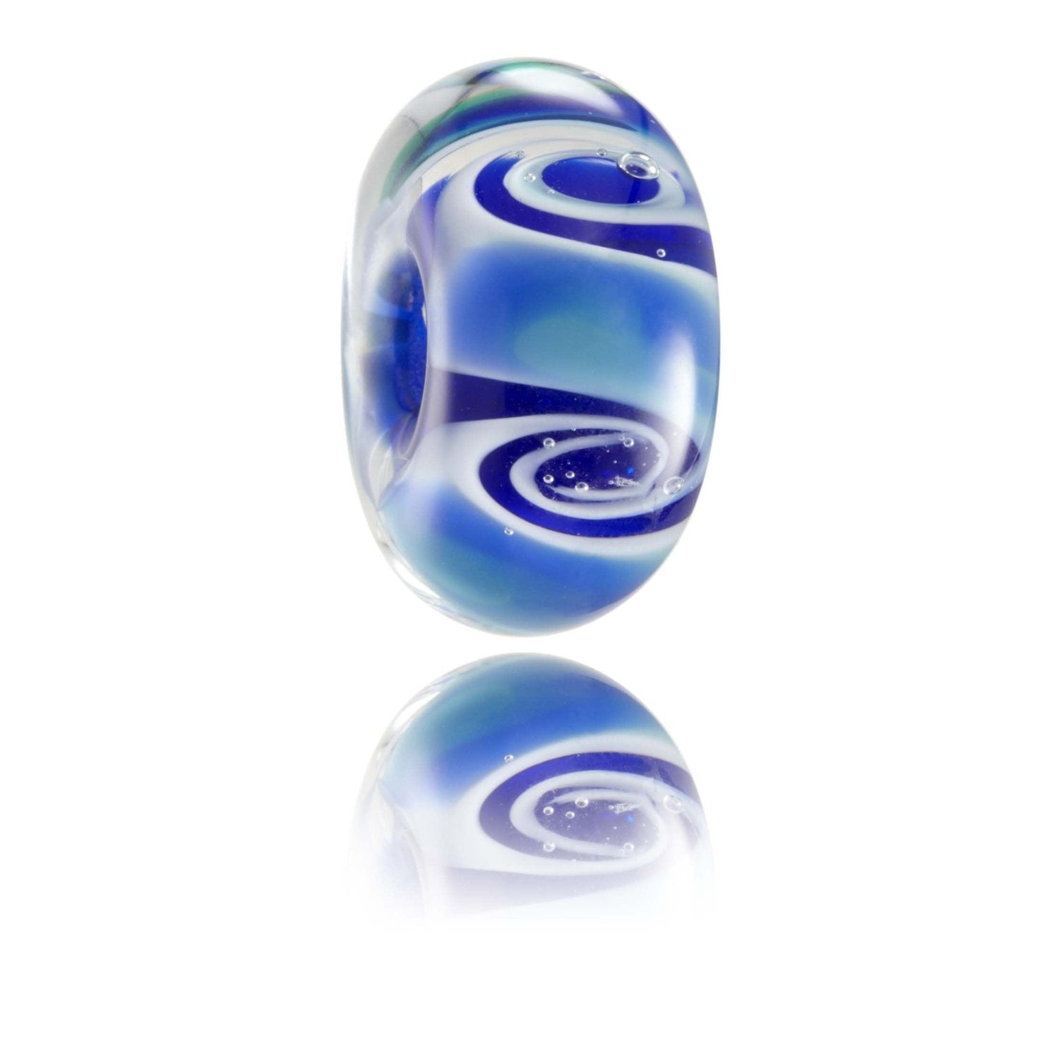 Blue, white and green swirling glass bead representing the Pacific Ocean.