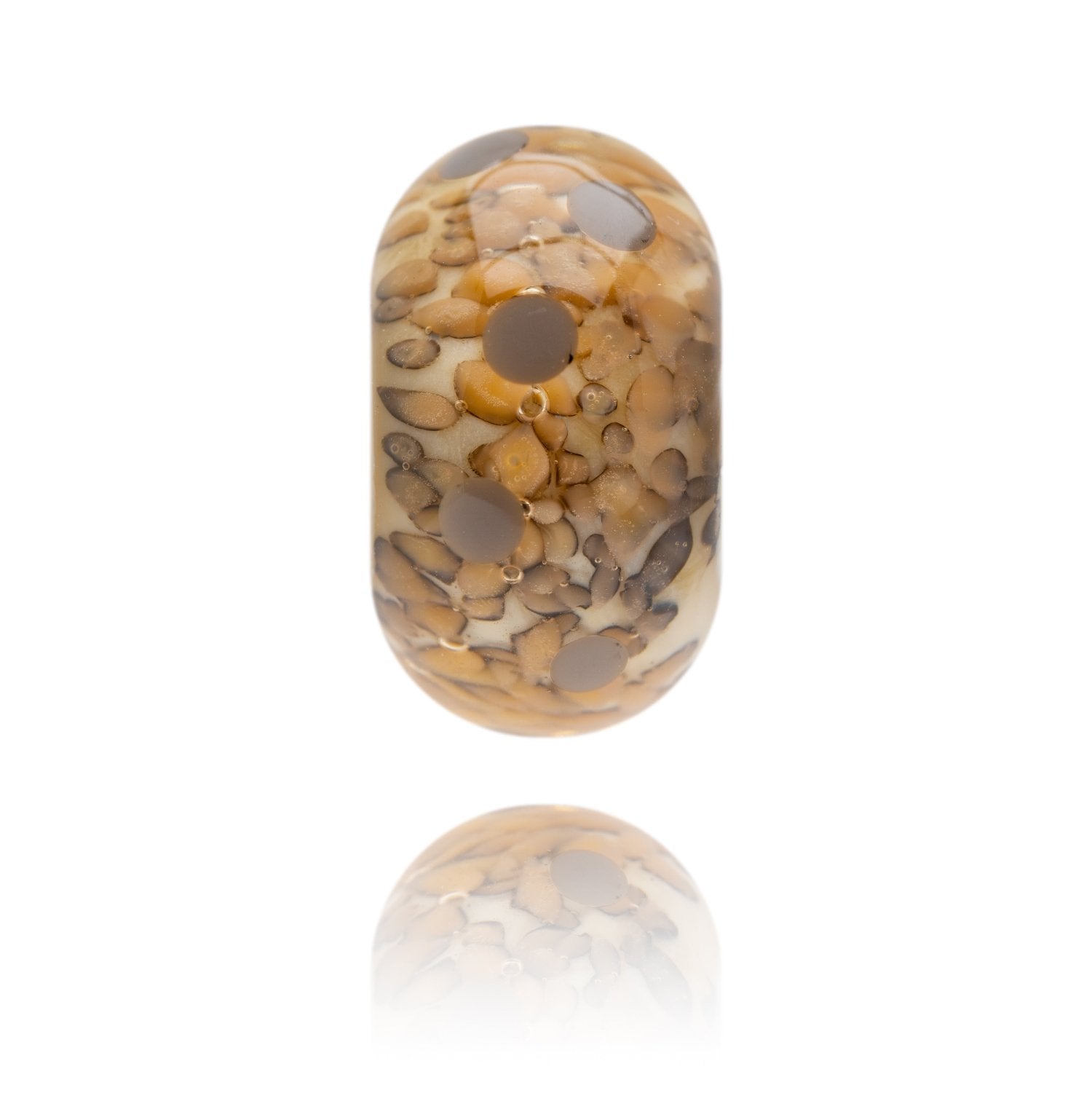 Cream glass bead with brown and grey mottled dots within the glass, representing Ogmore By Sea in South Wales, UK.