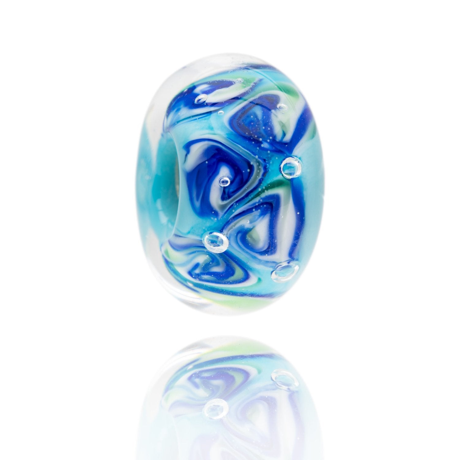 Blue, white and green swirling glass bead representing Perranporth beach in Cornwall.