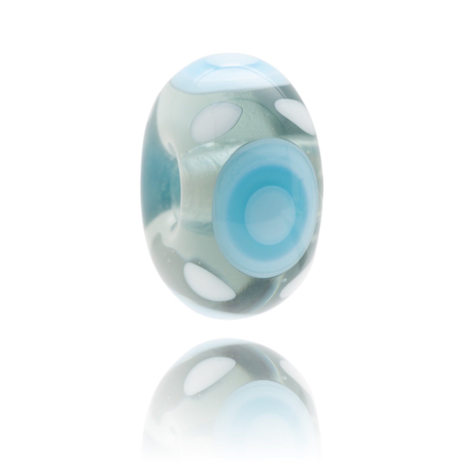 Transparent blue glass bead with circle patterns on the surface, represents Rest Bay in South Wales.