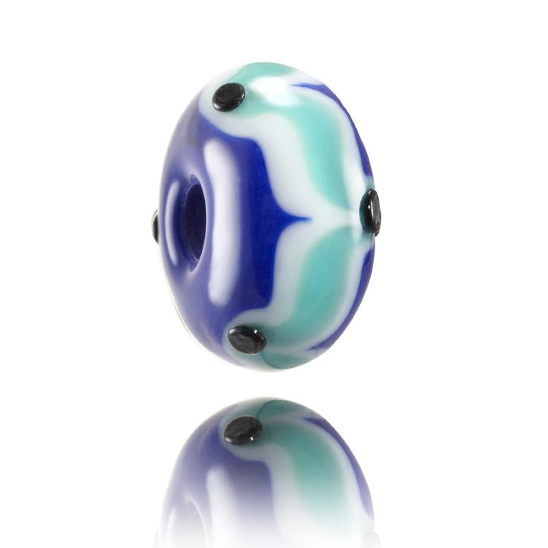 Dark blue and turquoise patterned glass bead with black dots representing Rio De Janeiro, Brazil.