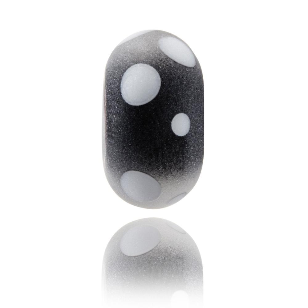 Frosted black glass bead with white dots on the surface representing Mont Tremblant in Canada.