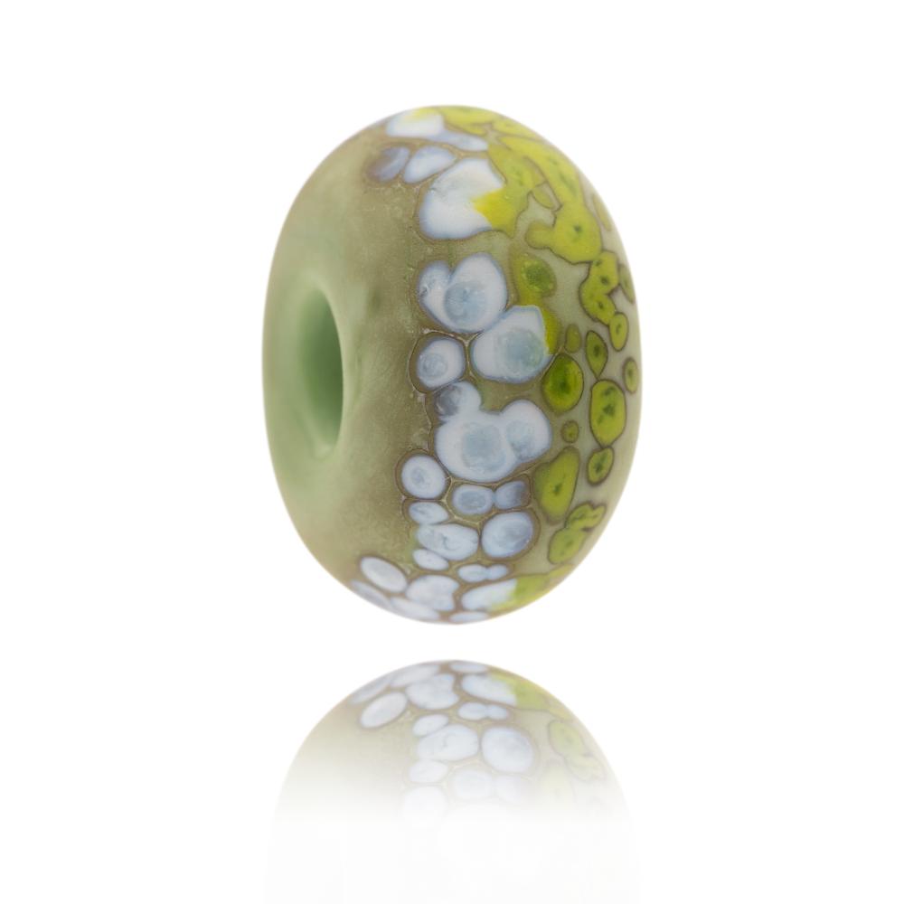 Green and white speckled glass bead representing the South Downs National Park in the UK.