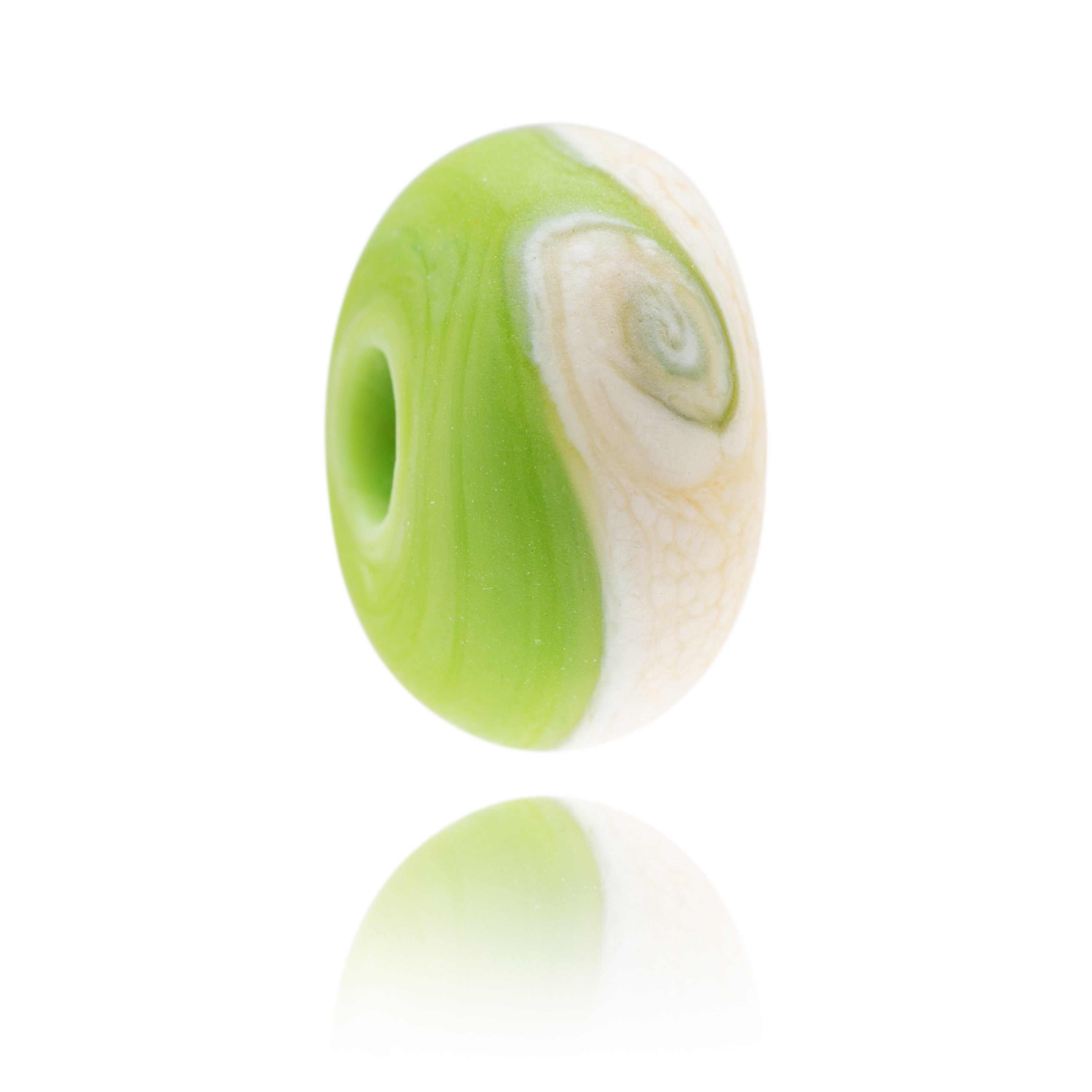Green and ivory glass bead made to represent Southbourne Beach in Dorset.