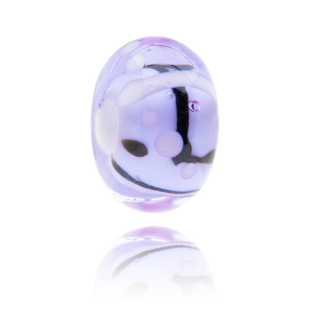 Glass bead in a transparent lavender colour with black lines representing Southwold in Suffolk.