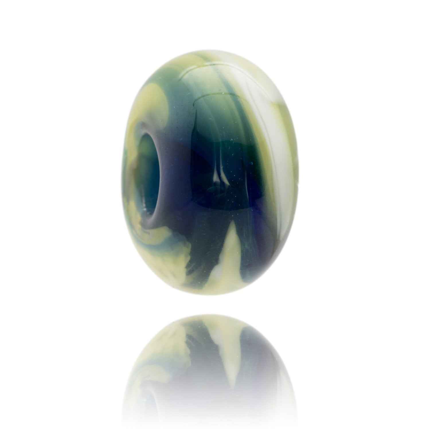 Blue, white, green and yellow swirling glass bead representing Studland Bay in Dorset.