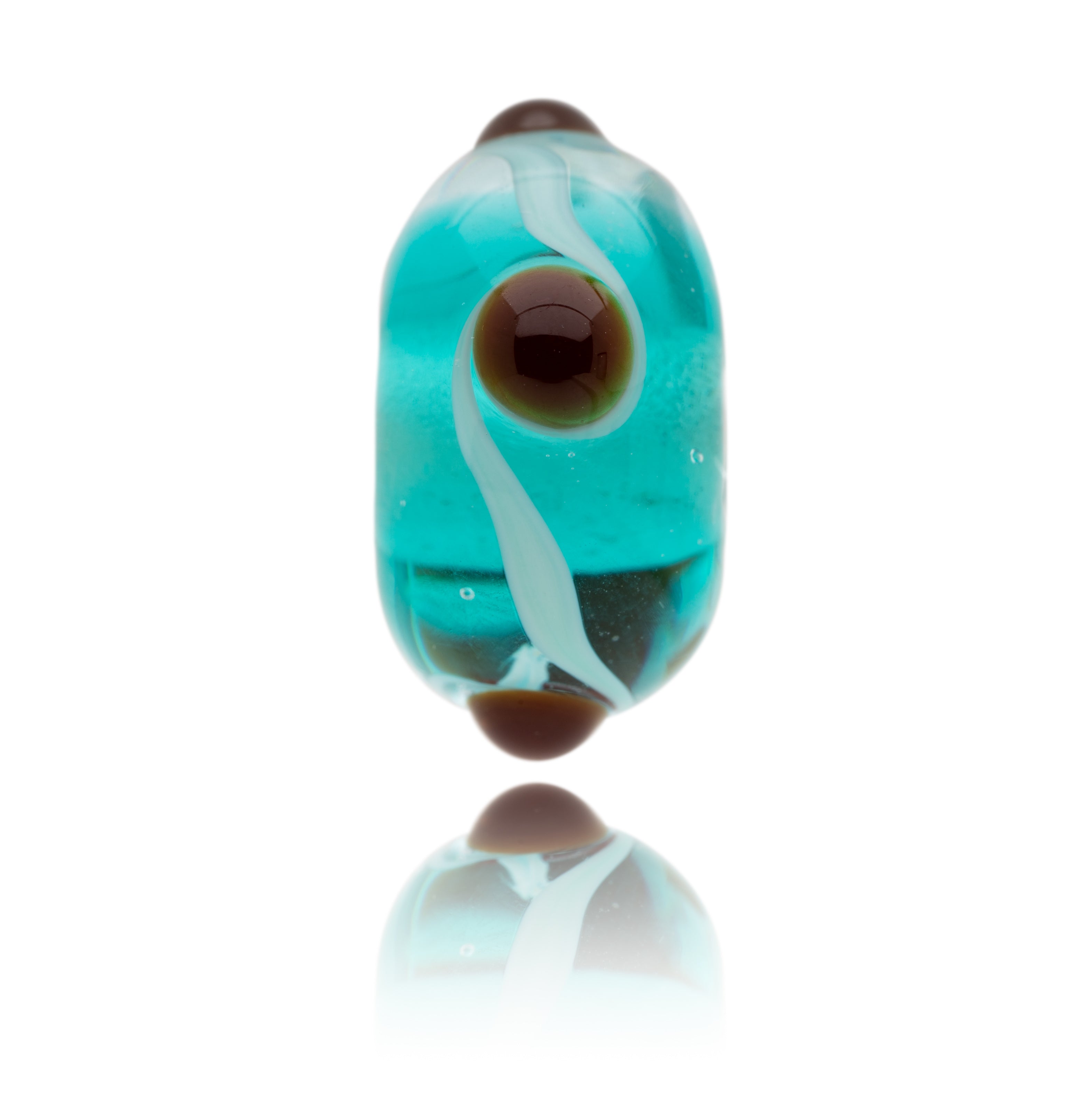 Turquoise and clear Murano glass bead with brown dots, representing Watermouth Cove in North Devon.