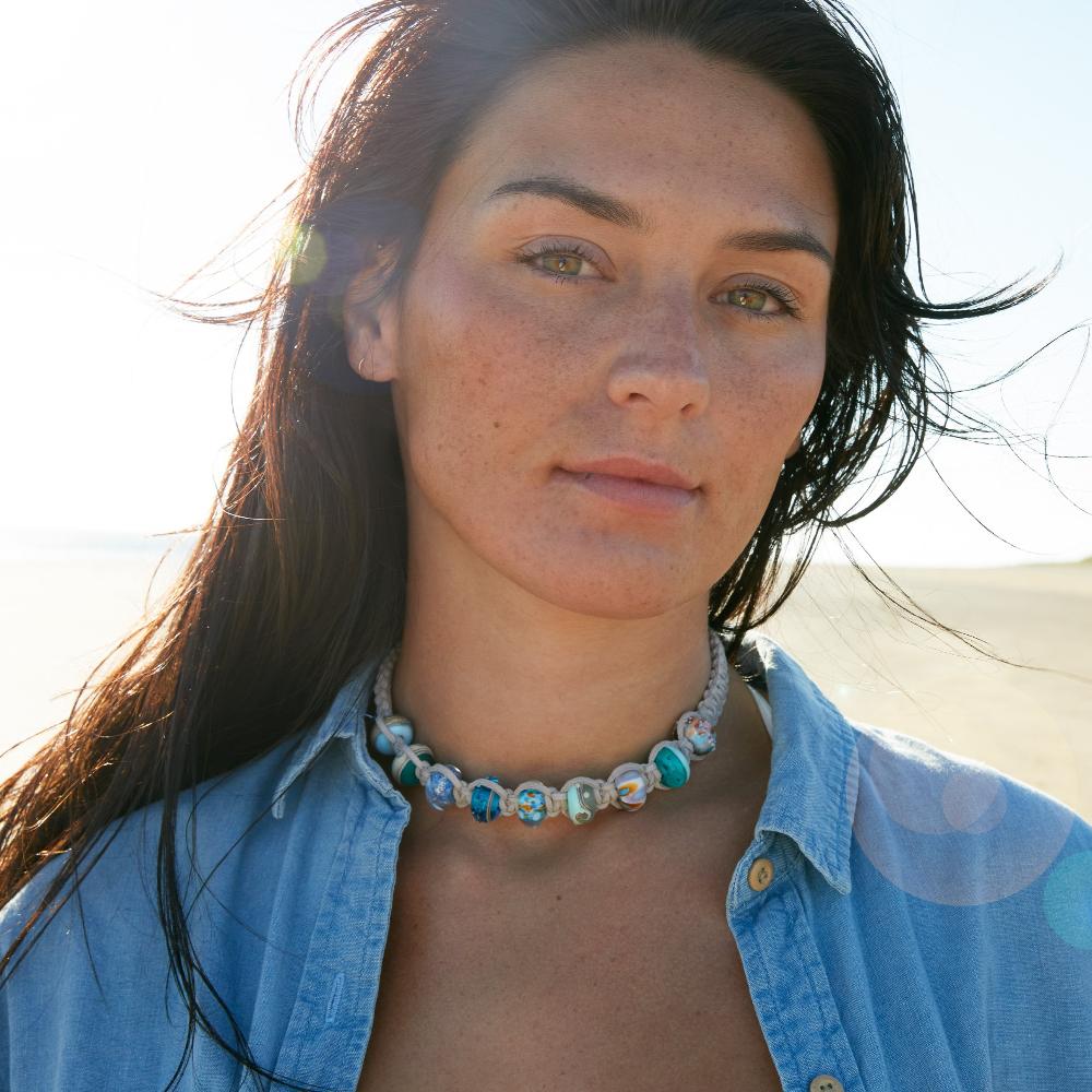 Colourful necklace made from glass beads representing Dorset and Cornish beaches and surf spots.