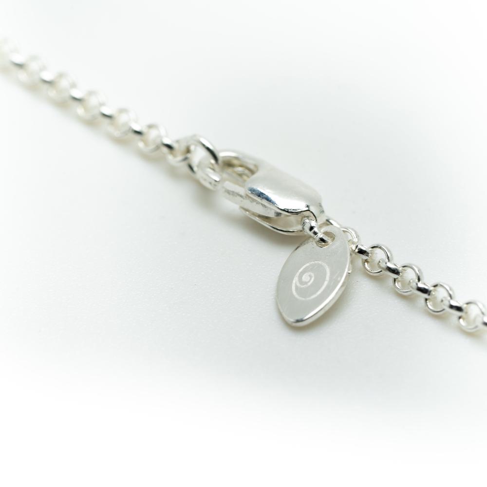 Silver chain necklace with silver Nalu tag and clasp.