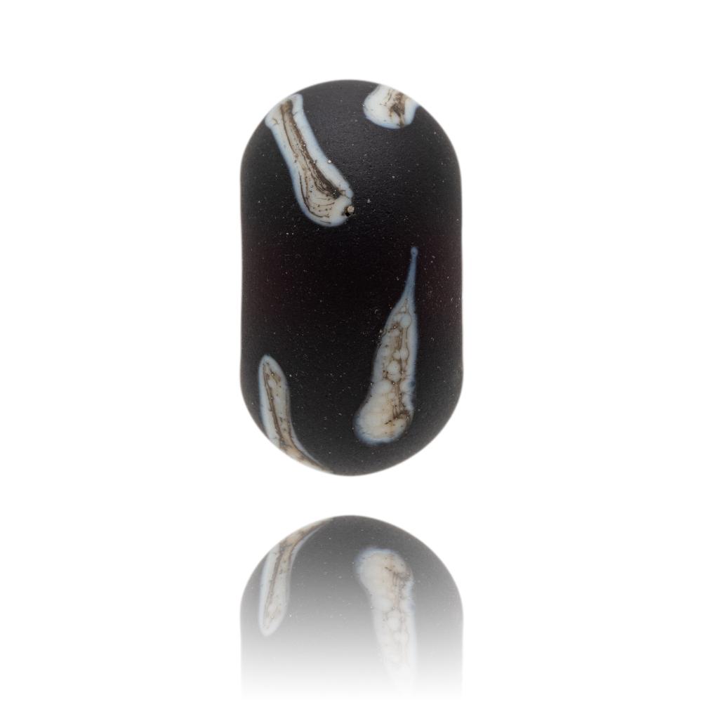 Dark purple glass bead with cream brown stripes across surface with a frosted sea glass finish. Representing the Isle of Arran in Scotland.