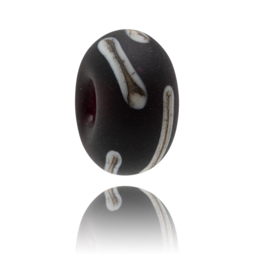 Dark purple glass bead with cream brown stripes across surface with a frosted sea glass finish. Representing the Isle of Arran in Scotland.