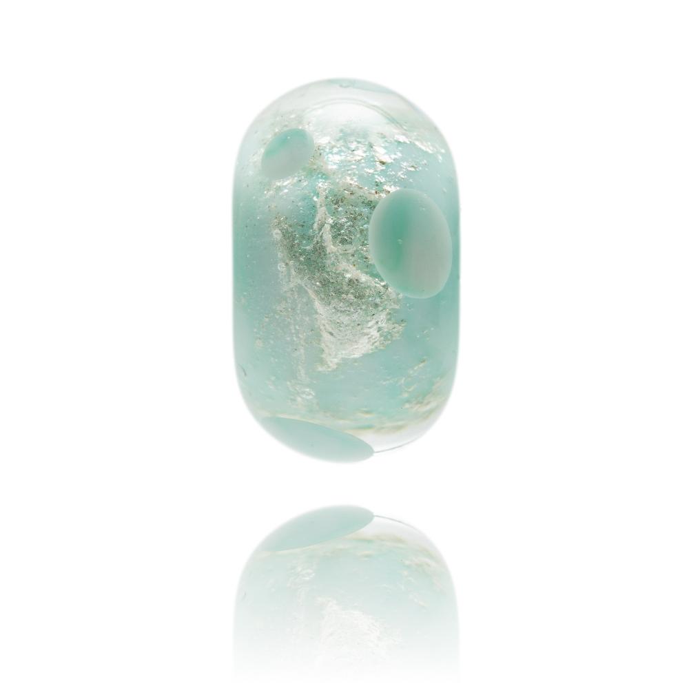 Pale green glass bead with shimmering core and green dots on surface, representing Lundy Island in North Devon.