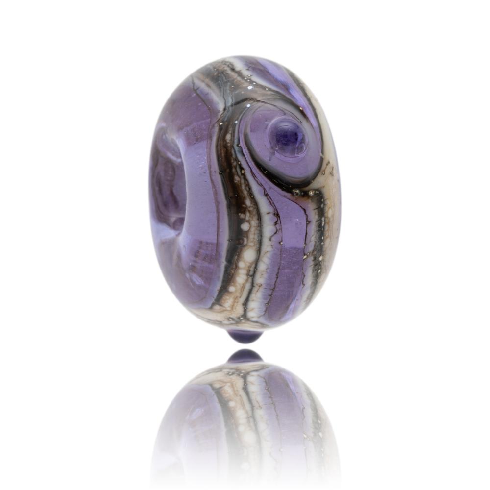 Purple glass bead with brown and cream swirls around the middle and dots on the surface, representing Machrihanish in Scotland.