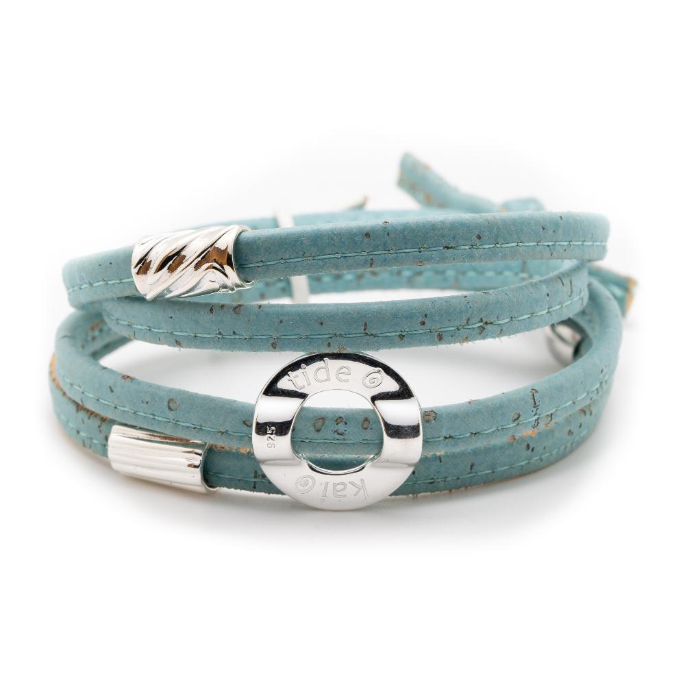 Turquoise cork bracelet with silver charms.