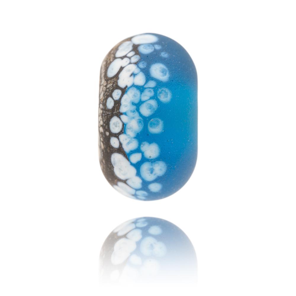 Brown and turquoise glass bead with white spots on the surface, representing a painting called Power Of Polzeath by Gemma Lessinger.