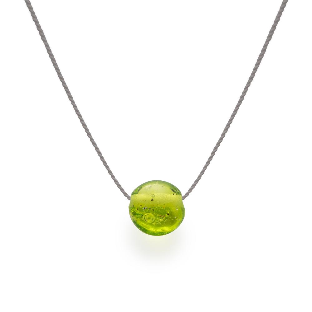 Apple green glass sand bead on silk cord.