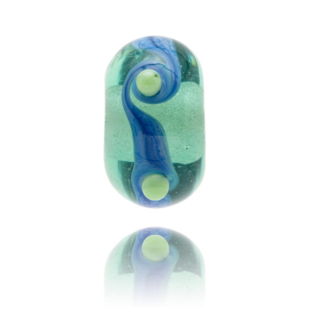 Green transparent bead with blue stripe round middle and green dots.