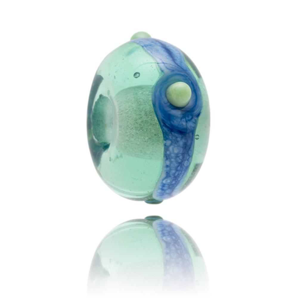 Green transparent bead with blue stripe round middle and green dots.