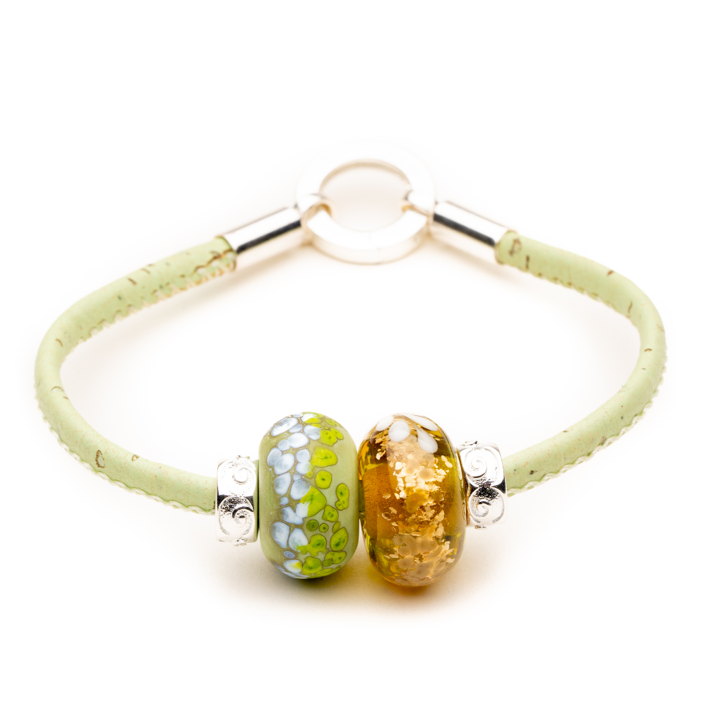 Green and white and gold glass beads on a mint cork bracelet.